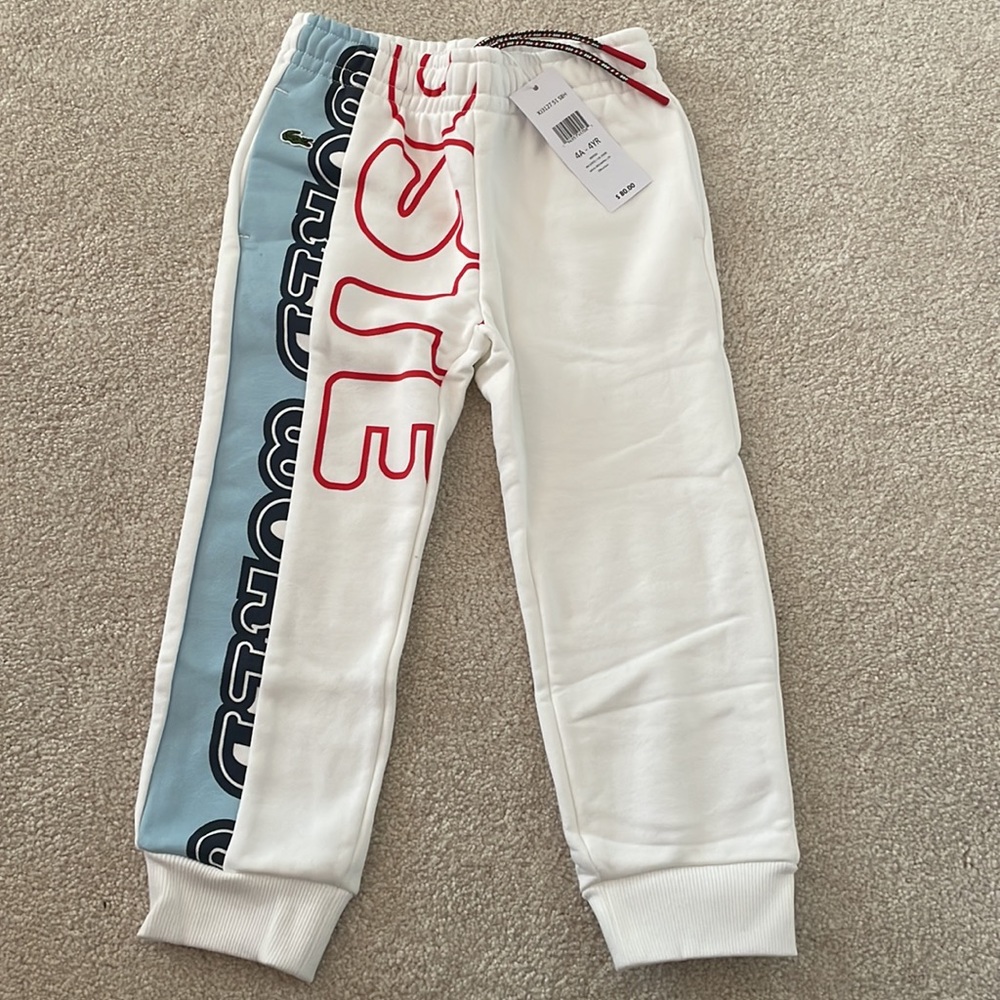 Lacoste NWT toddler boy size 4 white, red, navy and light blue logo joggers.